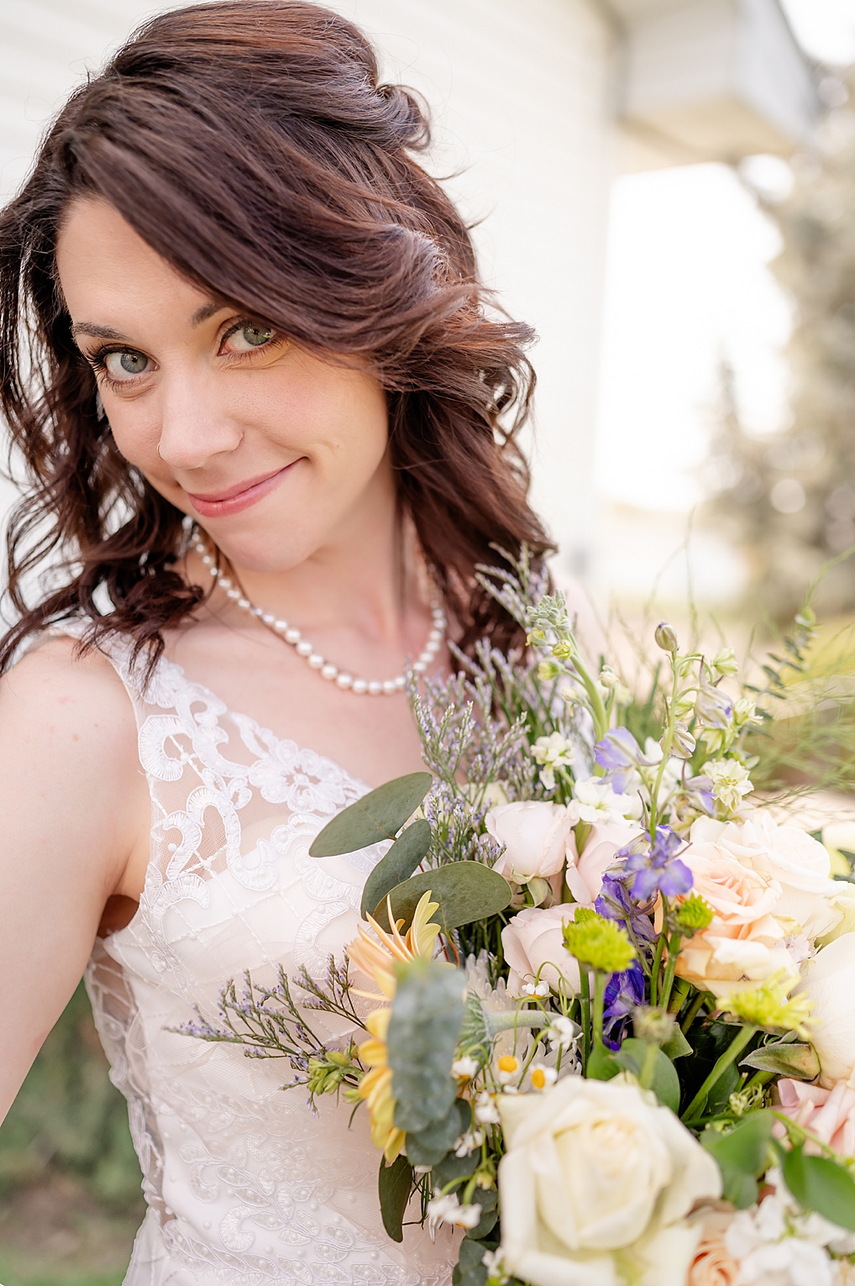 Close up photo of the bride and her flowers.